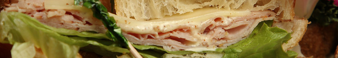 Eating Deli Sandwich at O'Bagel Bagelry & Deli restaurant in Stirling, NJ.